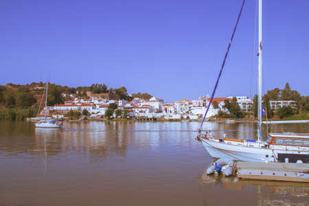 Alcoutim / Portugal; 08/19/2018. View of the border town of Alcoutim (Portugal) from the Sanl?car de Guadiana marina in Spain.のeditorial素材