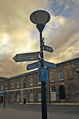 London / United Kingdom; 10/20/2013. Signs on a streetlight in Woolwich Arsenal, London, UK.