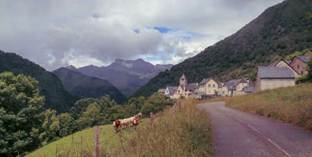 Natural landscape of Cette-Eygun, a small french village in the Pyrenees. St. Peter's Church at the background. France.の写真素材