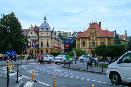 Brasov / Romania; 06/26/2018. Taxis on the Boulevard of the heroes and the post office building in...