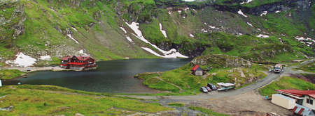 Arefu / Romania; 06/28/2018. The Balea cabin next to Lake Balea. Cabin located next to the famous road for its curves and its history DN7C or Transfagarasan highway in Romania.のeditorial素材