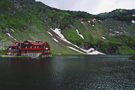 Arefu / Romania; 06/28/2018. The Balea cabin next to Lake Balea. Cabin located next to the famous road for its curves and its history DN7C or Transfagarasan highway in Romania.のeditorial素材