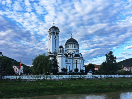 Sighisoara / Romania; 07/01/2018. Church of the Holy Trinity. A beautiful Orthodox church located next to the Tarnava River, a river that runs through the city.のeditorial素材