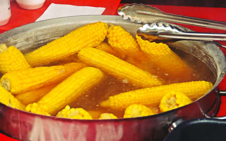 Corn cobs soaked before being roasted. Cobs for grilling at a Mamaia stall in Constanta, Romania.