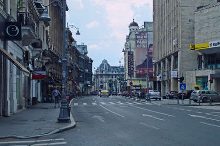 Bucharest / Romania; 07/07/2018. Victoria Street in the center of Bucharest. Car and people traffic on a summer weekday.のeditorial素材