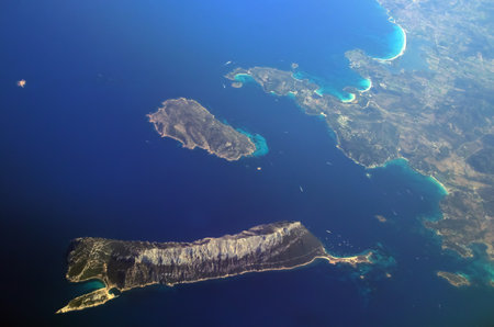 Tavolara and Molara islands and Cape Coda Cavallo, Sardinia, Italy. Aerial view from the window of a...