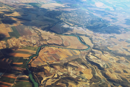 Tagus River as it passes through Illana (Guadalajara) and Estremera reservoir. Aerial photograph taken from the window of a passenger plane.の写真素材