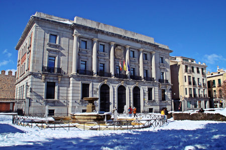 Avila, Spain; 02 10 2018. Building of the Territorial Management of the Cadastre, Delegation of Economy and Finance of Avila on a sunny day with snow. Adolfo Suarez square in winter.のeditorial素材