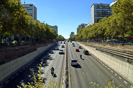 Madrid, Spain. 10 16 2018. Car traffic on the famous Paseo de la Castellana street in Madrid. Photograph taken at the exit of the tunnel located over the Plaza de Castilla roundabout on a sunny day.のeditorial素材