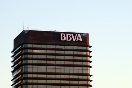 Madrid, Spain. 10 24 2018. BBVA bank building in the AZCA financial complex. BBVA building at dawn with work cleaning the window panes.のeditorial素材
