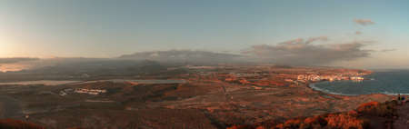 Sunset in the South of the island of Tenerife with the Teide volcano at the background. Panoramic...