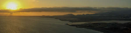 Sunset in the Atlantic Ocean from the south of the island of Tenerife, Canary Islands, Spain. Wind...