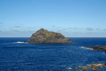 The islet known as Garachico, on the southwest coast of the island of Tenerife, near the town of the same name. Protected Natural Area where seabirds nest, Canary Islands, Spain.の写真素材