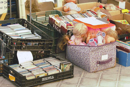 Madrid, Spain; 04 04 2021. Souvenirs and second-hand vintage objects displayed for sale in a street stall. El Rastro, a flea market in Madrid, it is a very crowded place on Sunday mornings.のeditorial素材
