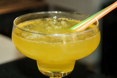 Close up view of a cocktail. Preparing a sex on the beach cocktail. Very palatable refreshing iced...