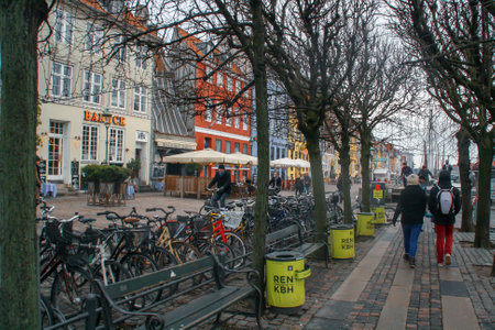 Copenhagen, Denmark; 02 14 2016. Nyhavn, Copenhagen's famous street along one of the city's canals. Street with brightly colored facades of its houses and hotels in a cloudy day of winter.のeditorial素材