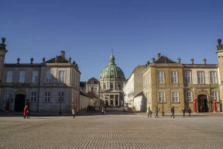 Copenhagen, Denmark; 02 16 2016. Frederik's Church and tourists waiting for the ceremony of the changing the guard in Copenhagen. It is popularly known as The Marble Church for its Rococo architectureのeditorial素材