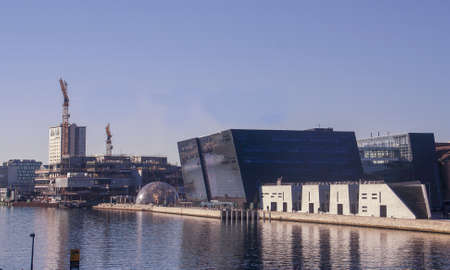 Copenhagen, Denmark; 02 16 2016. The black diamond (Royal Danish Library) and harbor of Copenhagen. Structure of the modern building on a sunny winter day.のeditorial素材
