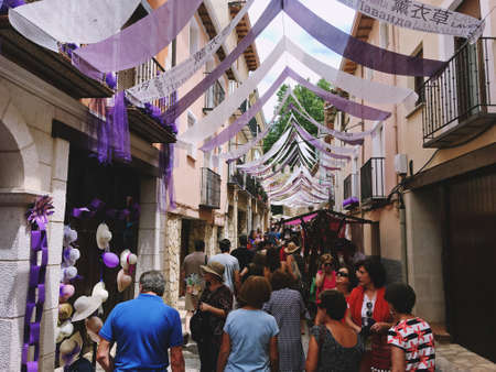 Brihuega, Spain. 07 21 2018. Brihuega Lavender Festival in the summer flowering period. Tourists strolling through the streets of Brihuega decorated with the colors of lavender.のeditorial素材