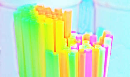Colorful and abstract desktop background. Plastic straws. Creative work transforming photographs...