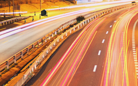Night traffic on the M607 road in Madrid, Spain. Moving car lights after long exposure from Tres...