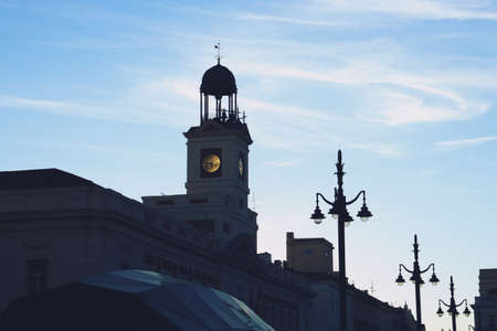 Silhouette of the facade of the building of the Presidency of the Community of Madrid (in Spanish: Presidencia de la Comunidad de Madrid). Facade of the Royal Post Office in Plaza del Sol at sunset.の写真素材