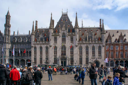 Bruges, Belgium; 04 28 2016. The West Flanders Provincial Court in Market Square. It is a Neogothical building and is the former meeting place for the provincial government of West Flanders.のeditorial素材