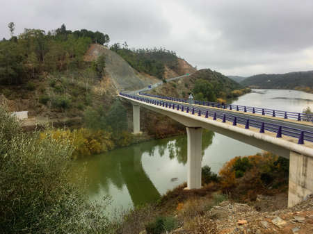 26 12 2017. International bridge between Spain and Portugal in PomarÃ£o. HU-6400 road. Bridge over the Chanza River, a tributary of the Guadiana River, a few kilometers from its mouth.の写真素材