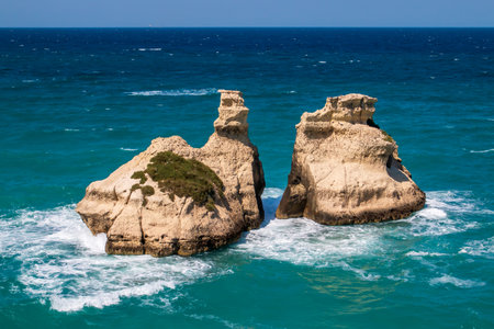 Cliffs and outcrops at Torre dell'Orso beach, Lecce, Italy. Outcrop of Le Due Sorelle in Italian which means the two sisters.の写真素材