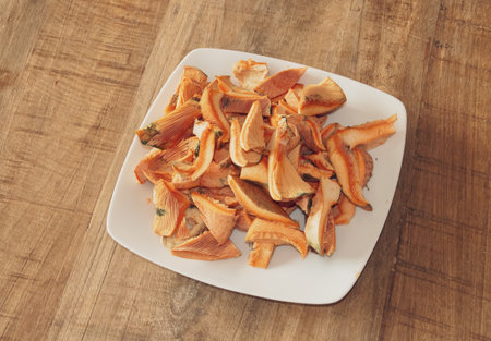 Dish of fresh and washed chopped mushrooms. Dish of Lactarius deliciosus, delicious milk cap, saffron milk cap or red pine mushroom ready to be cooked. Madrid, Spain.の写真素材