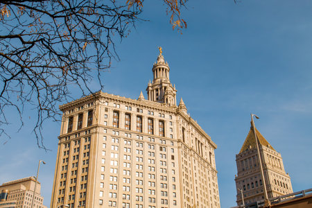 Facade of the David N. Dinkins Municipal Building in Manhattan, New York. Neoclassical style building with Roman details such as the golden statue on the dome called Civic Fame.の写真素材