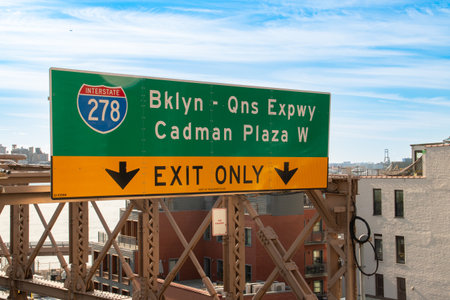 Traffic sign indicating the exit on the Brooklyn Bridge. Traffic sign at the entrance to the...