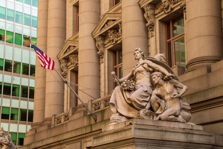 Entrance to the George Gustav Heye Center, one of three branches of the National Museum of the American Indian. Facade decorated with columns and statues in Manhattan, NYC, USA.の写真素材