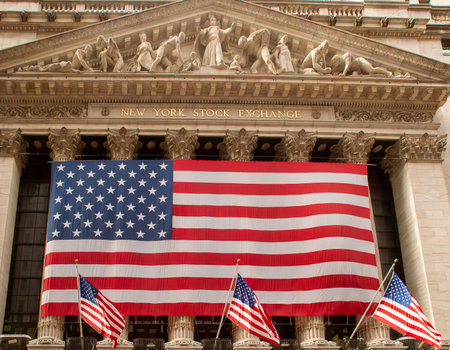 Close-up of the American flag displayed at the New York Stock Exchange on Wall Street. Flag stretched over the columns supporting the entrance tympanum.の写真素材