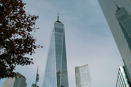 Cityscape with skyscrapers in the Financial District of New York, USA. The One WTC skyscraper from the intersection of Cedar St and Greenwich St to its right is Four WTD. Nov 2019.の写真素材
