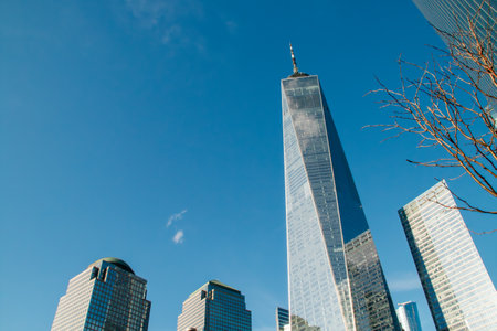 Cityscape with skyscrapers of the financial district in New York, USA. The One World Trade Center skyscraper from the intersection of Cedar Street and Greenwich Street. 2019.の写真素材