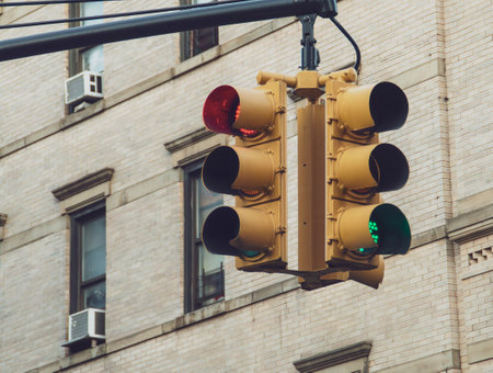 Traffic light in New York City, USA. Traffic light and in the background the facade with windows of a residential building. Traffic light on Grand Street and Orchard Street.の写真素材