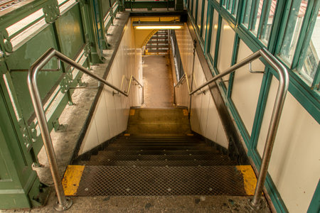Stairs in Harlem, Manhattan, New York City, USA. Stairs leading to the subway station on the bridge over Broadway Street, at the intersection with W 125th Street.の写真素材