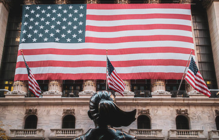 Statue of the Fearless Girl in front of the New York Stock Exchange, New York, USA. The American flag on the facade of the Stock Exchange. Wall Street, November 2019.の写真素材