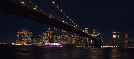 Brooklyn Bridge and Manhattan skyline at night, New York City.