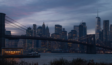 Brooklyn Bridge in New York City at dusk with skyscrapersの写真素材