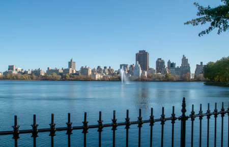 Cityscape of the Jacqueline Kennedy Onassis Reservoir in Central Park, New York, USA. View of the New York skyscrapers from the lake's west shore, highlighting 1250 Madison Avenue.の写真素材