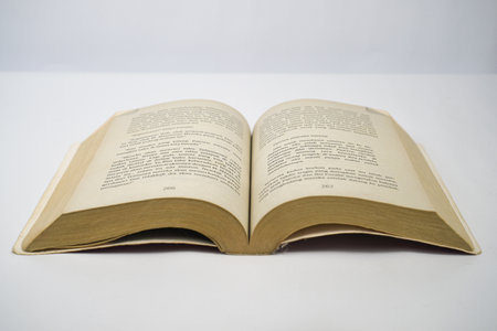 Yogyakarta, Indonesia - January 06, 2023: Open old book on white background. Photographed using...