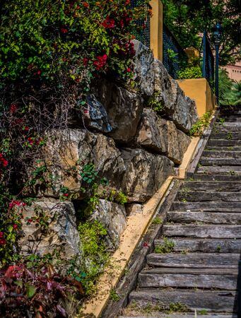 wooden stairs in playground in marbella with stone wallの写真素材