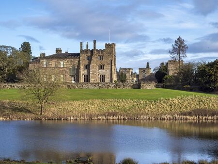 View of Ripley Castle from across the lake in the surrounding parkland, North Yorkshire, Englandのeditorial素材