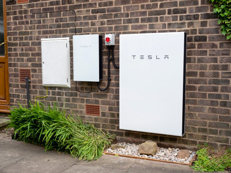 Tesla Powerwall 2 and Gateway 2 battery storage system installed on a brick house wall
