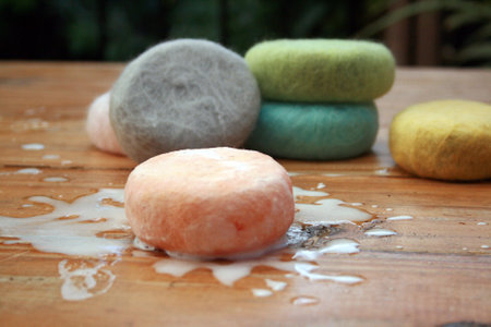Organic wool covered soaps with bubbles.の写真素材