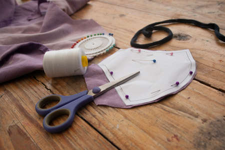 Making fabric face masks at home from a pattern.の写真素材