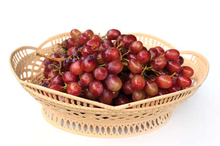 Red grapes on a white background.の写真素材