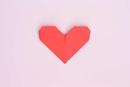 love heart on pink paper backgroundの写真素材